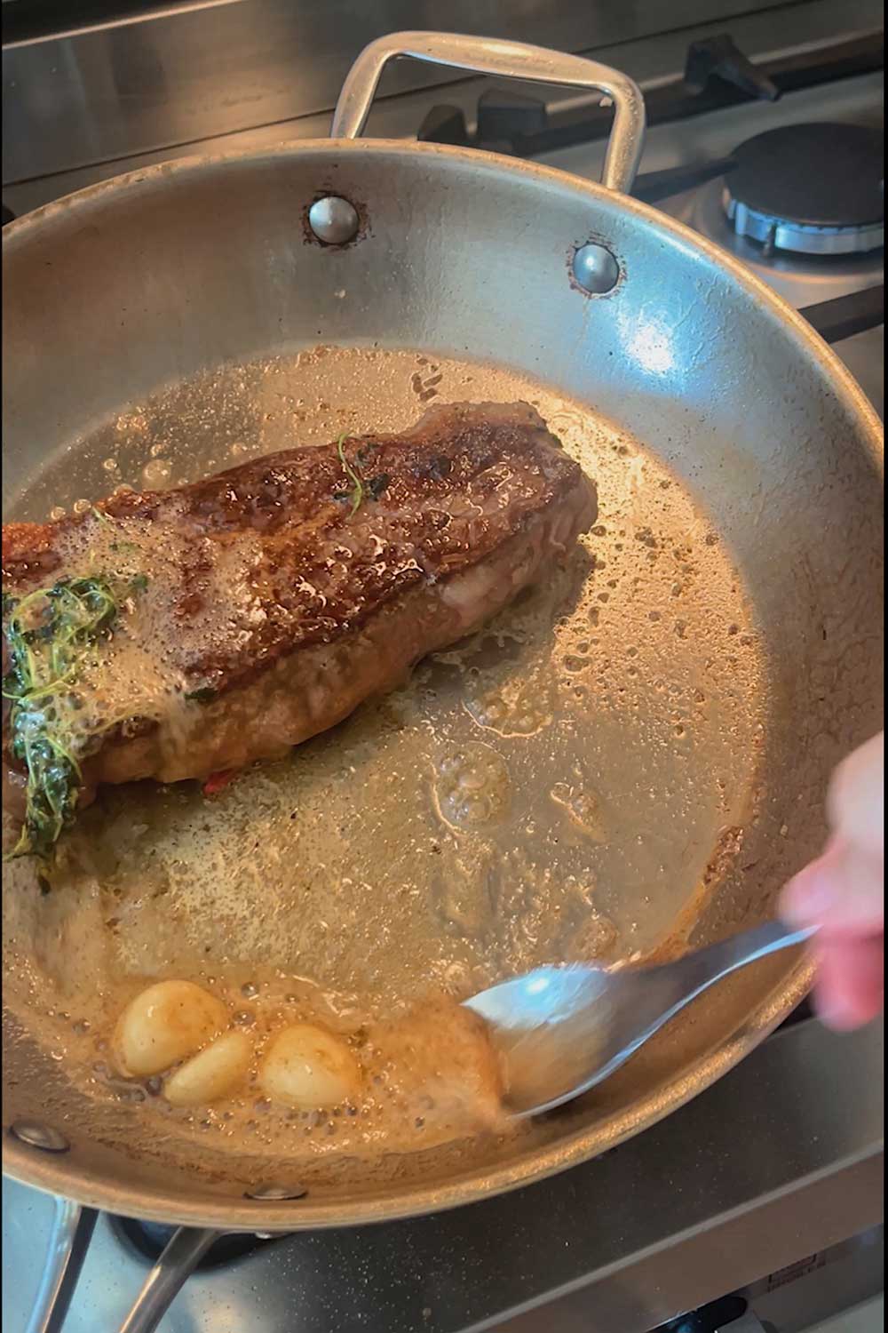 basting-ribeye-steak-with-garlic-thyme-butter