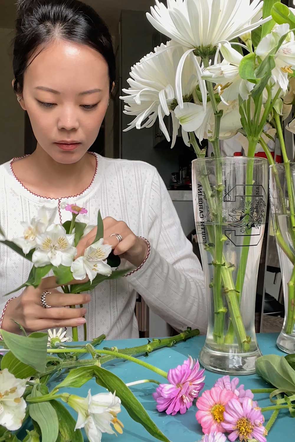 creating floral arrangement with hydroponic zinnias grown inside my indoor flower garden