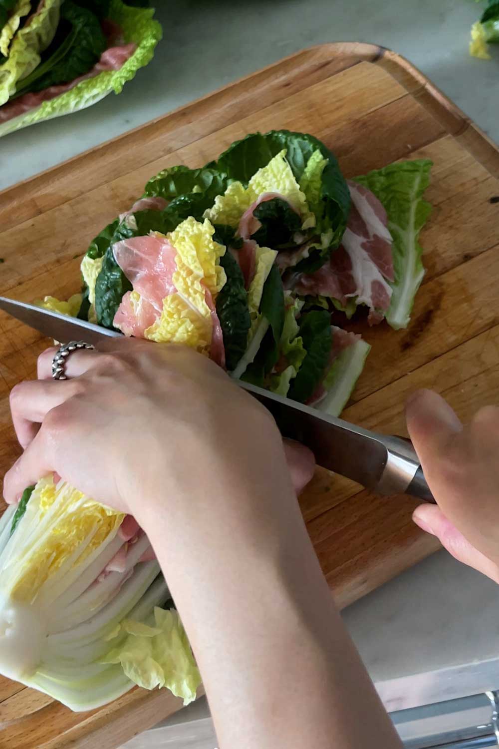 cutting-cabbage-pork-belly-and-tatsoi-layers-to-make-mille-feuille-nabe