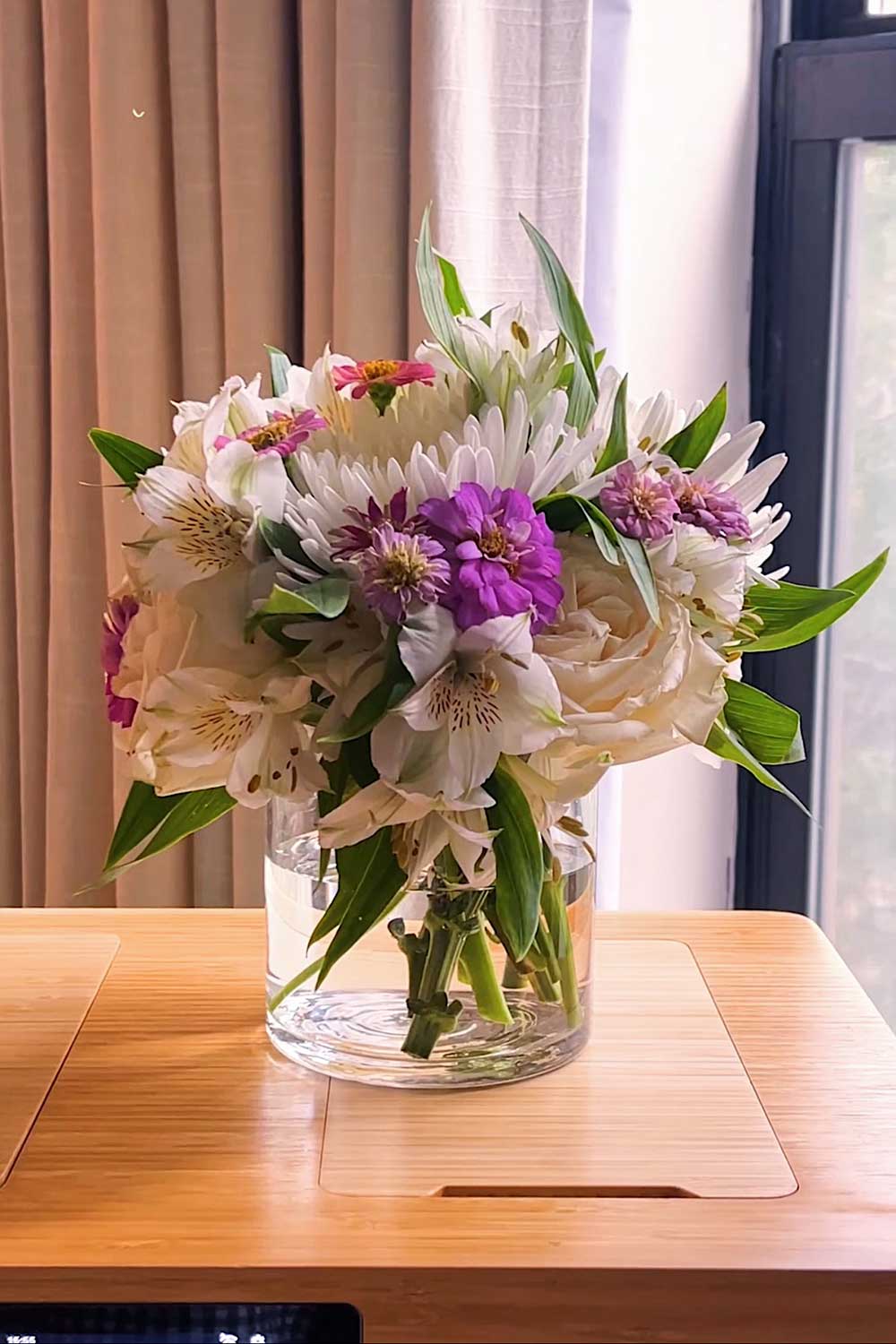 floral arrangement with lilies spider mums and pompom zinnias