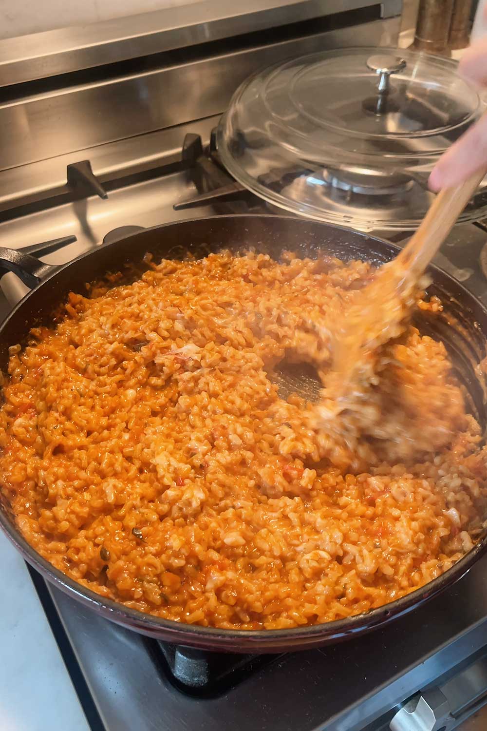 parmesan cheese grated into risotto