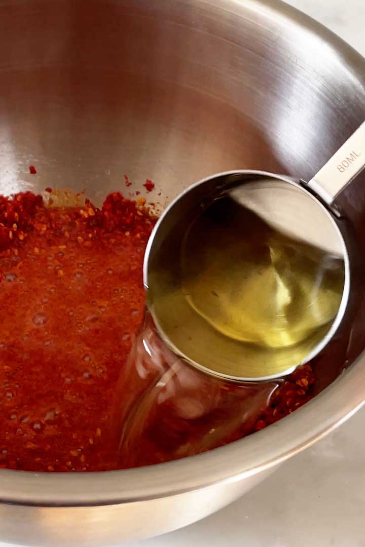 pouring-oil-over-chili-powder-to-make-spicy-chili-oil